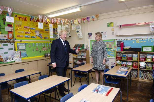 UK Prime Minister Boris Johnson has said he understands the "anxiety" felt by pupils waiting for results after exams were cancelled and he is "very keen" assessments should go ahead as normal in the coming school year. "Clearly, because of what has happened this year, there is some anxiety about what grades pupils are going to get, and everybody understands the system that the teachers are setting the grades, then there's a standardisation system," he told reporters on a visit to a school in east London. "We will do our best to ensure that the hard work of pupils is properly reflected." Results day for A-levels, AS-levels and BTecs in England, Wales and Northern Ireland is on Thursday, while GCSE results will be released next week. It comes after thousands of students in Scotland received worse results than expected last week, with the Scottish Qualifications Authority accused of disproportionately affecting the grades of schools which have previously presented fewer successful pupils for exams. The prime minister also reiterated his message that it was the country's "moral duty" for children to return to classrooms and "the last thing" the government wanted to do was close schools.