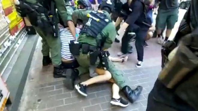 Hong Kong protests: Police tackle 12-year-old girl to the ground