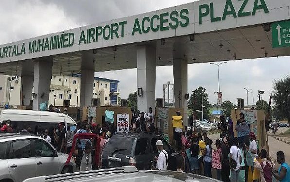 They obstructed traffic and delayed vehicles from accessing the airport through the plaza.