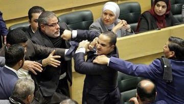 Jordan lawmakers exchange punches during heated Parliament session shown live on national tv (video)