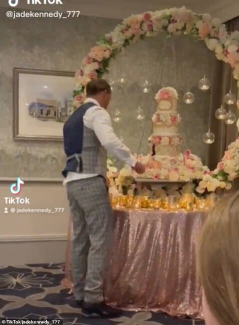 Shocking moment groom smashes wedding cake into bride's face