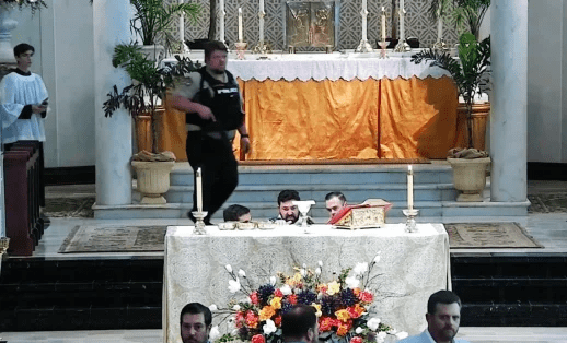 Armed teen wearing all black enters Catholic church with a riffle allegedly to massacre families during First Holy Communion ceremony before he's taken down by parishioners (video)