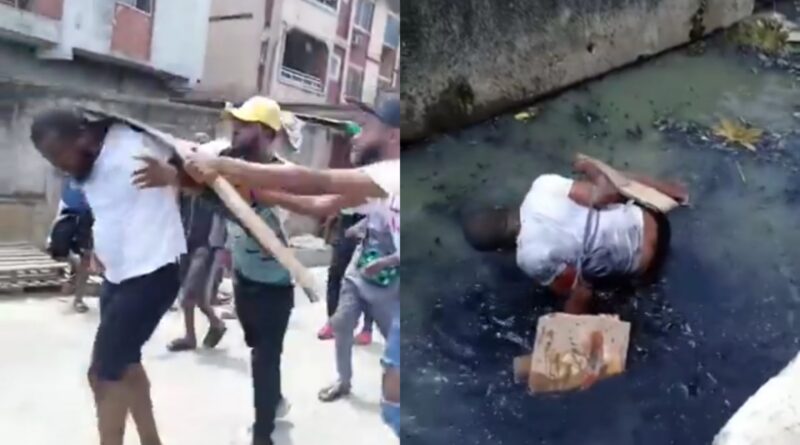 Outrage as man is tied up and beaten with bottles and planks before being thrown in gutter for allegedly being gay in Nigeria (video)